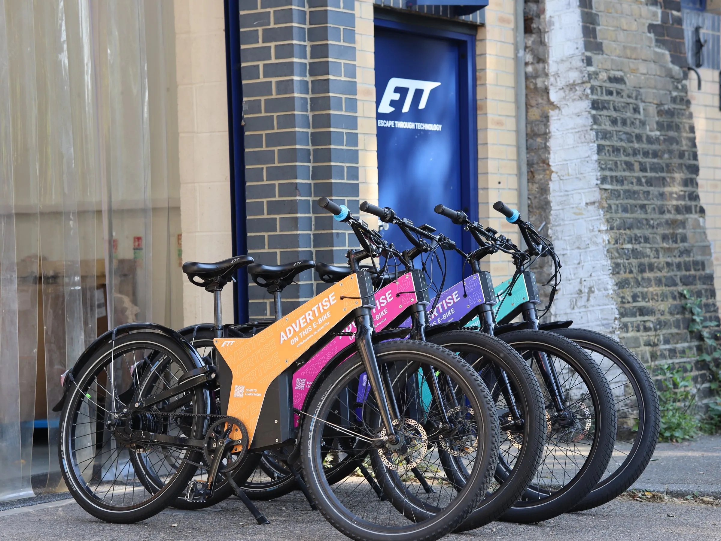 Fleet of colourful ETT AdRider e-bikes