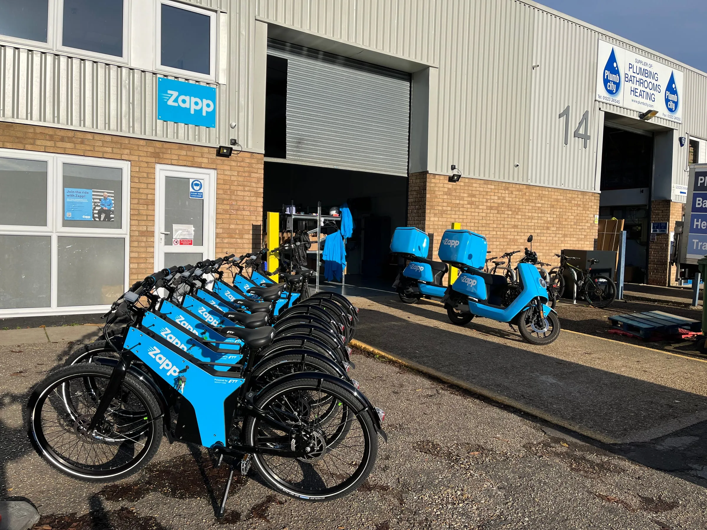Zapp-branded ETT fleet lined up outside the warehouse
